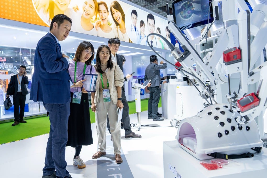 Visitors looking at Fosun Pharma’s locall-produced Da Vinci surgical system in the Medical Equipment and Healthcare Exhibition Area during the CIIE 2023 Expo in Shanghai on November 6. Shanghai, China. Photo: Future Publishing via Getty Images