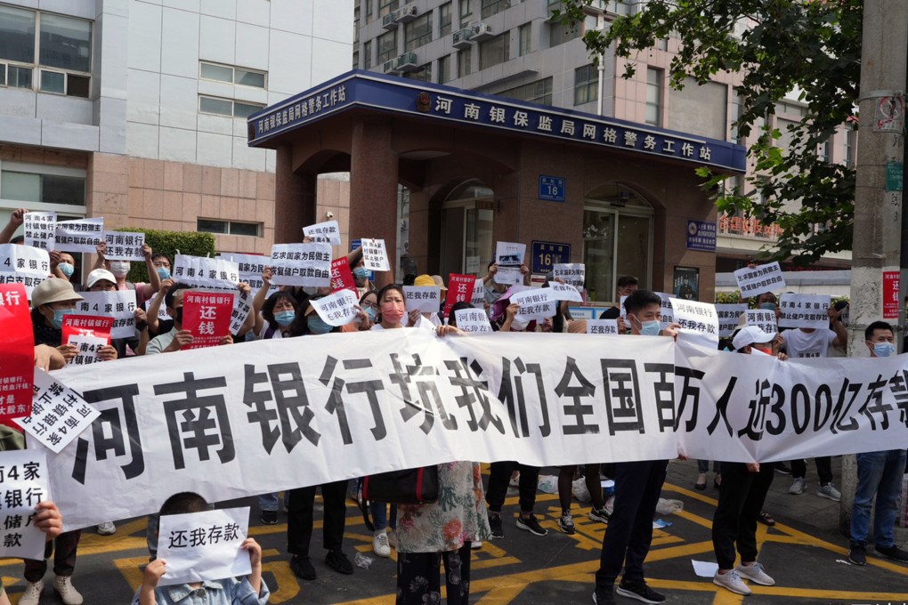 Residents protest in front of the Henan branch of the former China Banking and Insurance Regulatory Commission In Zhengzhou in May last year over a rural bank scandal. Photo: Weibo