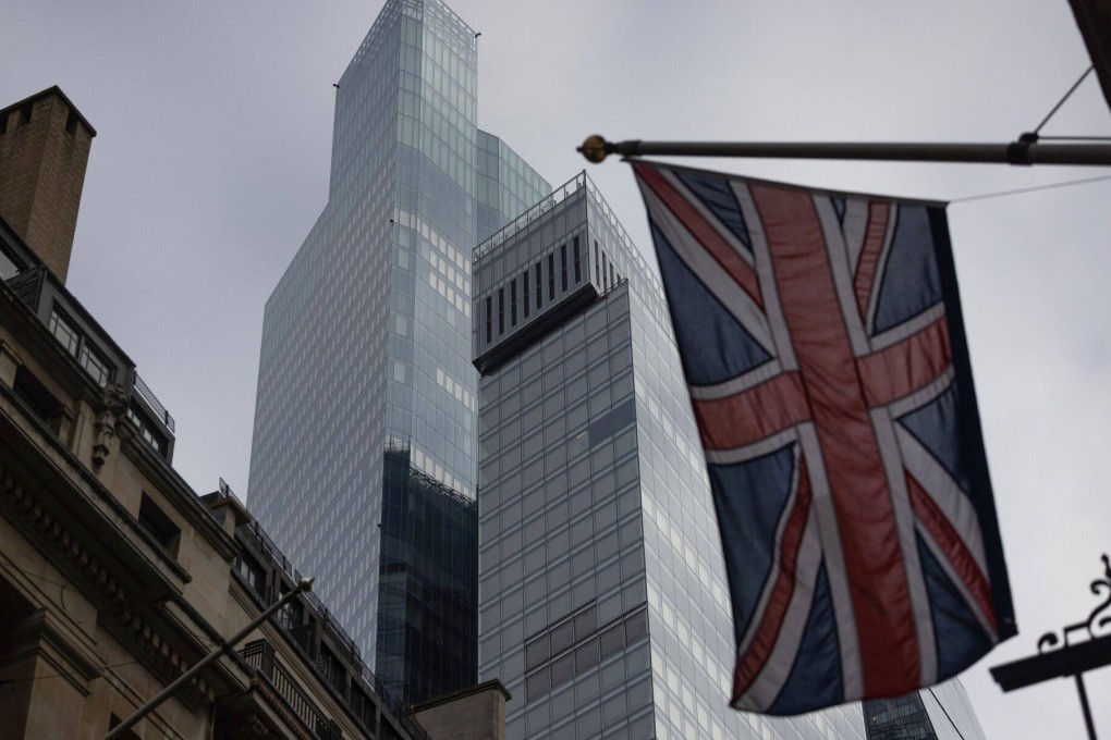 A British Union flag flies near office buildings in the City of London on October 25. London’s commercial property market has retained its allure for Asian investors. Photo: Bloomberg