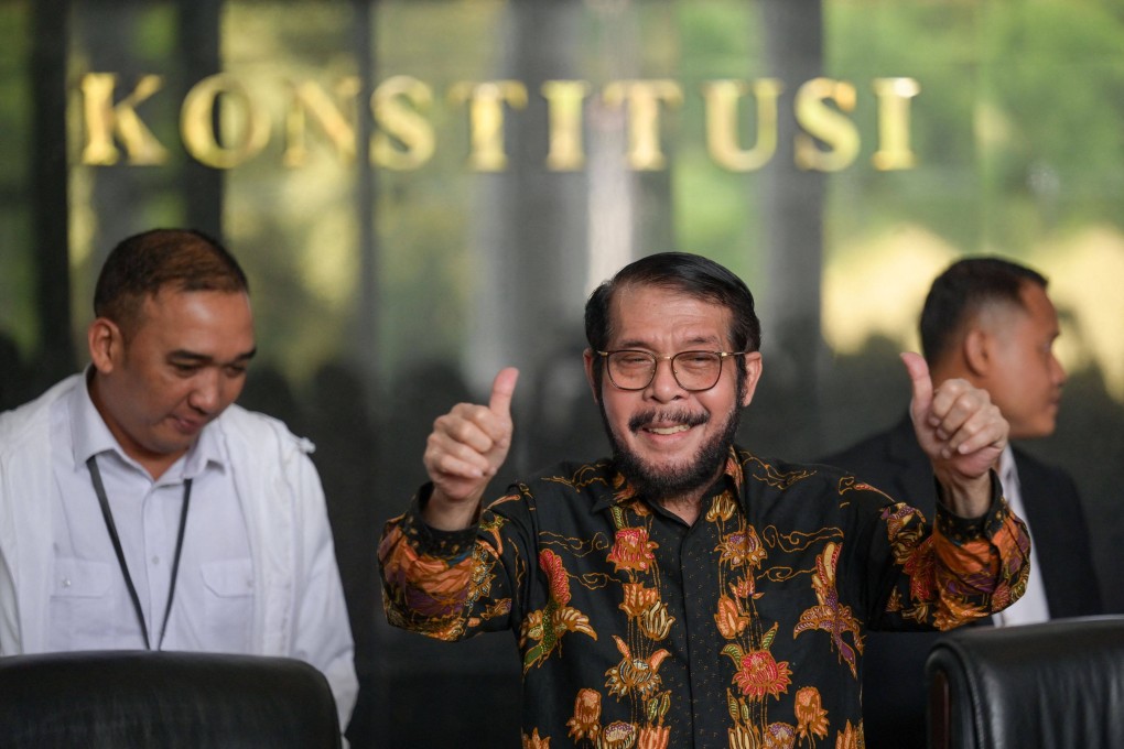 Former chief justice of the Constitutional Court Anwar Usman (centre) gestures before delivering a press statement in Jakarta on November 8. Though stripped of his position as chief justice, Anwar remains a judge in the court. Photo: AFP
