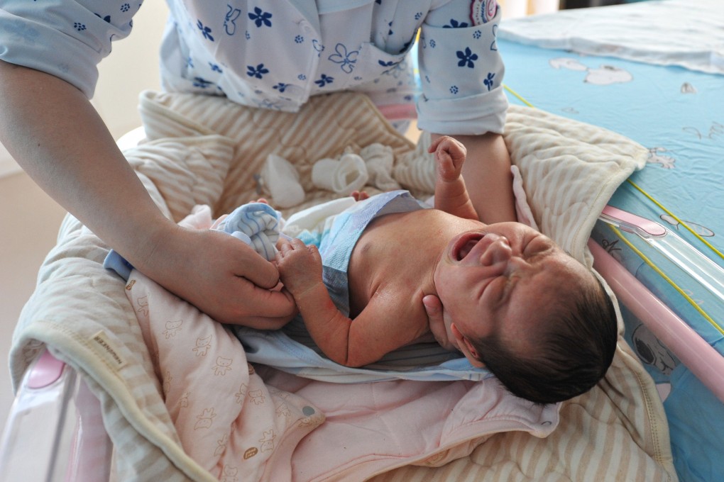 A baby being given a health check by a nurse in Anhui, China on January 17. Photo: Getty Images