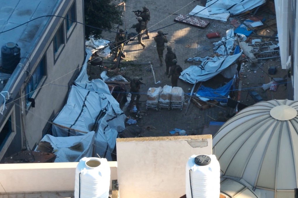 Israeli soldiers walk at the al-Shifa hospital complex, amid their ground operation against Palestinian Islamist group Hamas, during what they say is a delivery of humanitarian aid to the facility in Gaza City, on Wednesday. Photo: Israeli Defence Forces/Handout via Reuters
