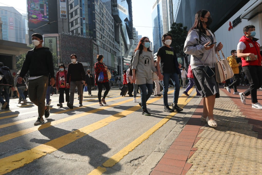 People walk in Causeway Bay, Hong Kong, on December 28, 2022. Photo: Xiaomei Chen
