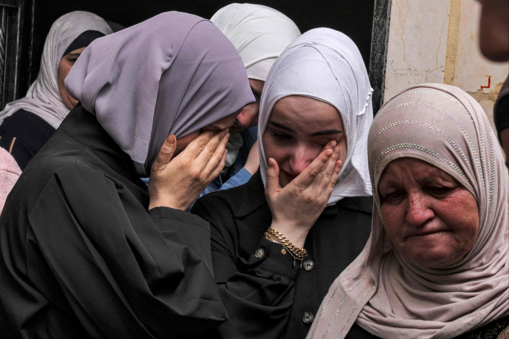 Relatives of a 66-year-old taxi driver shot dead in Hebron, in the southern West Bank. Photo: AFP