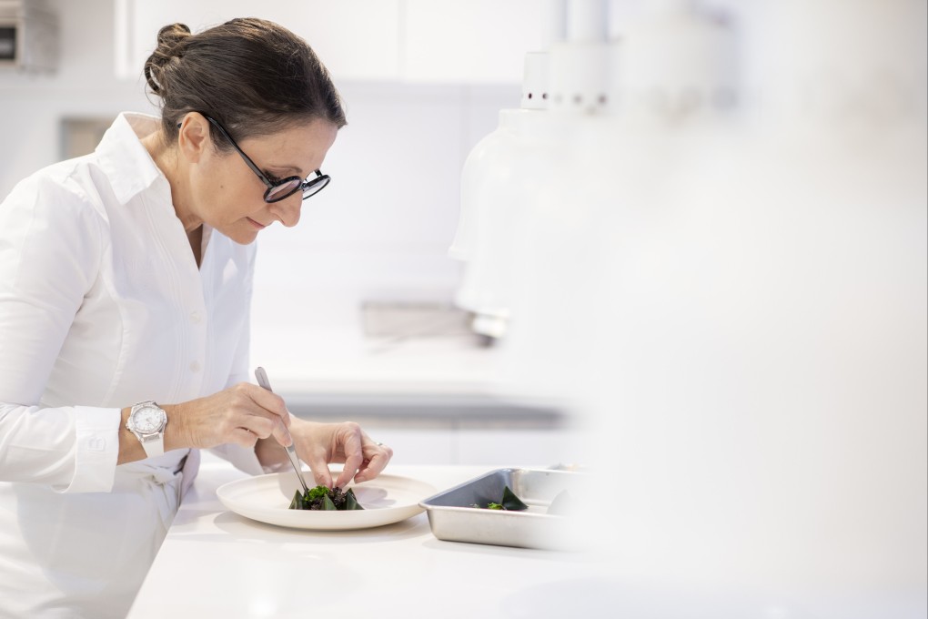 Anne-Sophie Pic, one of the world’s most lauded French chefs, whose restaurants have 10 Michelin stars, prepares a dish. She was in Hong Kong to open her newest restaurant, Cristal Room. Photo: Emmanuelle Thion