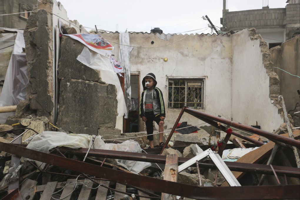 A Palestinian boy stands amid the destruction on Wednesday after Israeli strikes on Rafah, in the Gaza Strip. Photo: AP