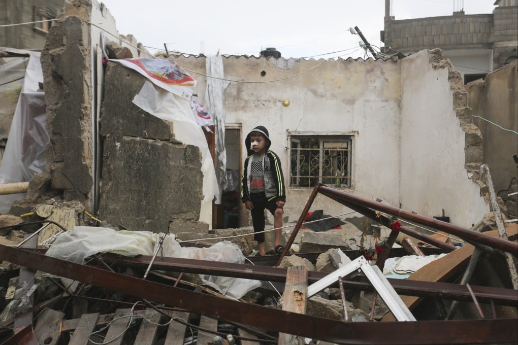 A Palestinian boy stands amid the destruction on Wednesday after Israeli strikes on Rafah, in the Gaza Strip. Photo: AP
