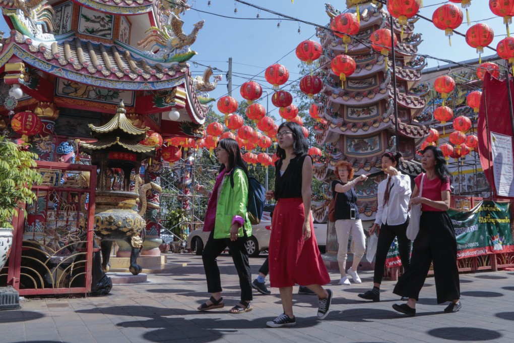 Chinese tourists visit the Pung Tao Gong Chinese Temple in Chiang Mai, Thailand. Photo: AP