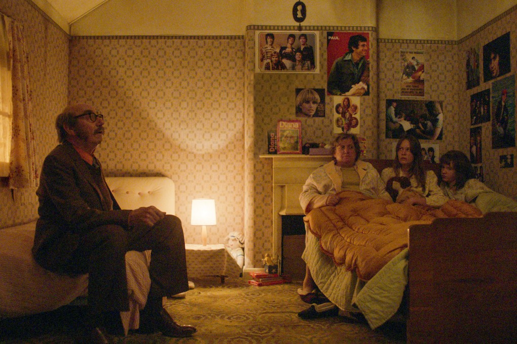 Christopher Ettridge as Maurice Grosse, Paula Benson as Peggy Hodgson, Charlotte Miller as Margaret Hodgson and Olivia Booth-Ford as Janet Hodgson in “The Enfield Poltergeist”, a dramatisation of an investigation into the haunting of house in London that began in 1977. Photo: Apple TV+