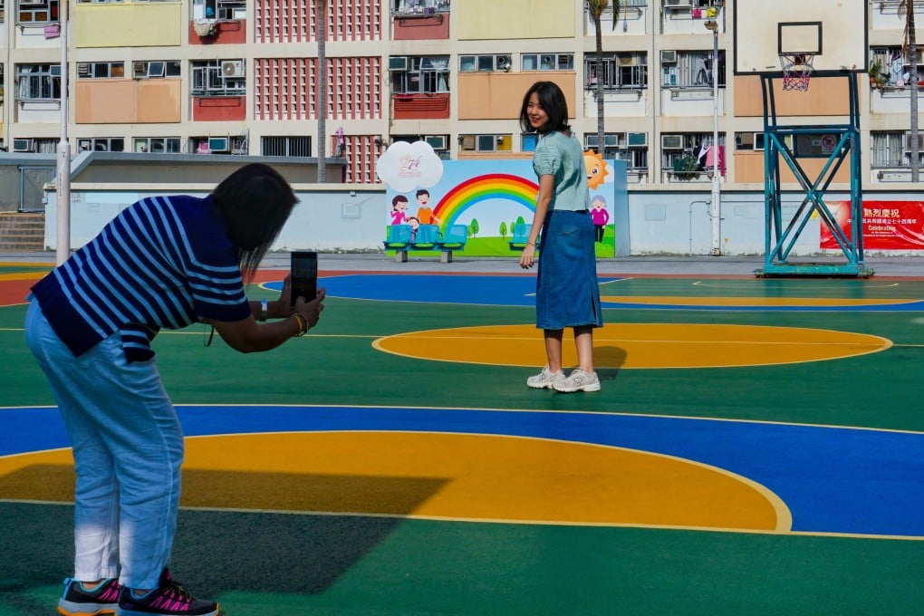 People take photos at Choi Hung Estate on November 6. The Housing Authority reportedly plans to demolish and rebuild the 60-year-old estate that has become a tourist hotspot. Photo: Elson Li