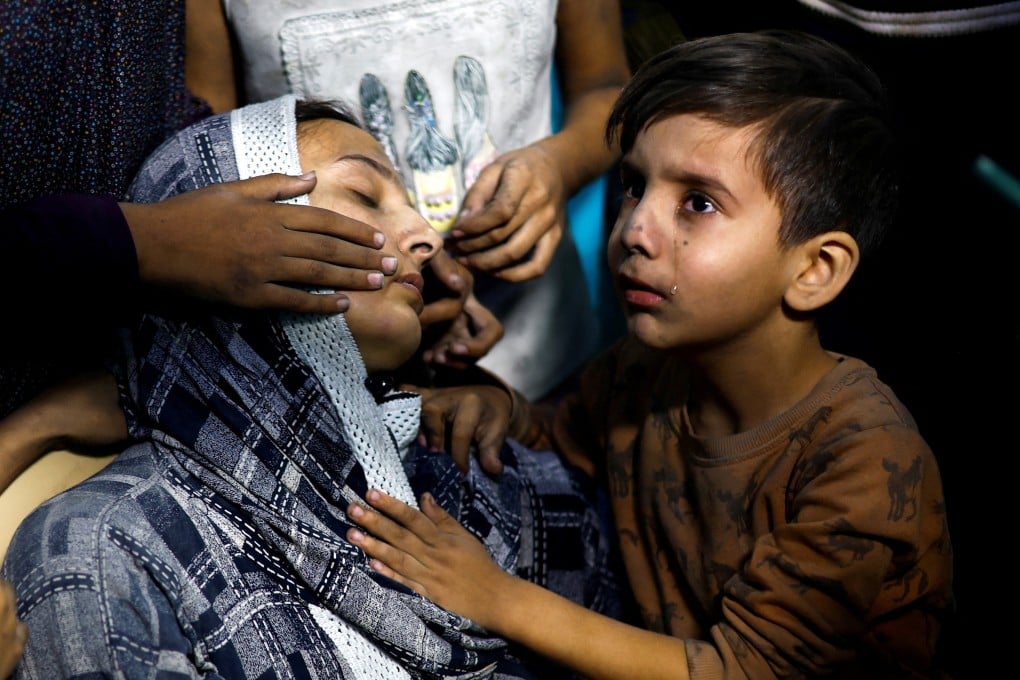 A Palestinian child and his mother in a southern Gaza hospital on Monday. Photo: Reuters