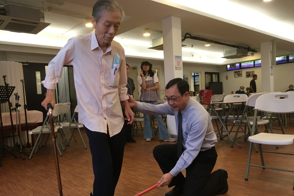 Saint Barnabas’ Society and Home’s chairman Dr Lui Wai-Hee, a specialist in orthopaedics and traumatology, tests an elderly client’s ability to lift his feet. Photo: Cindy Sui