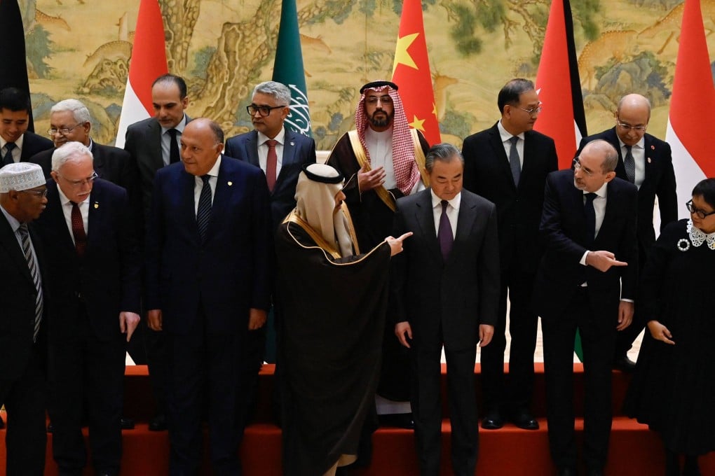 China’s Foreign Minister Wang Yi (front row third from right) hosts a delegation of foreign ministers from Arab and Muslim majority countries at the Diaoyutai State Guest House in Beijing on Monday. Photo: AFP