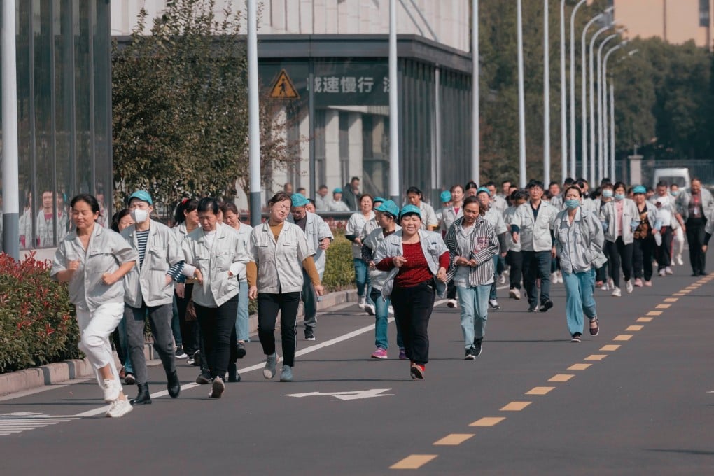 Some workers run to have lunch at the Hualida clothing factory canteen in Changzhou, Jiangsu province, on November 14.
Retirement age in China is among the lowest globally – 60 for men, 55 for white-collar women. But with better nutrition and healthcare, workers in this cohort are retiring with longer, healthier lives ahead of them. Photo: EPA-EFE