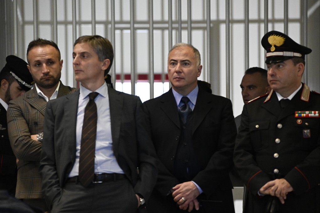 Officials listen as judges read the verdicts of a maxi-trial of hundreds of people accused of membership in Italy’s ‘ndrangheta organized crime syndicate. Photo: AP