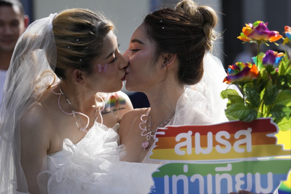Women kiss while holding a poster to support marriage equality, during a Pride Parade in Bangkok. Thailand’s Cabinet on Tuesday,  approved an amendment to its civil code to allow same-sex marriage, with an expectation for the draft to be submitted to Parliament next month. Photo: AP