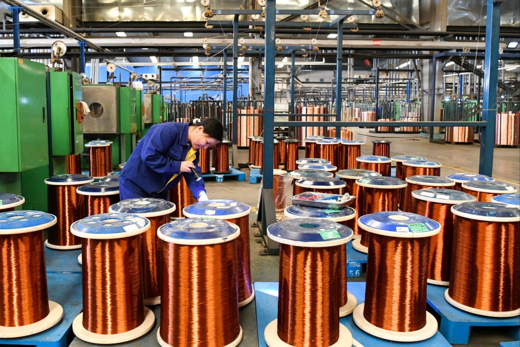 An employee manufactures copper wires at the workshop of Tongling Nonferrous Metals Group Holdings in Tongling, Anhui Province, China on November 13. Photo: VCG via Getty Images