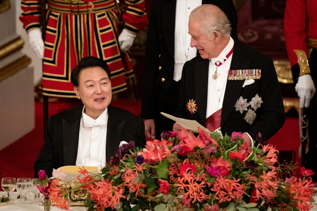 South Korean President Yoon Suk-yeol listens as Britain’s King Charles speaks at a state banquet on Tuesday. Photo: PA Wire via dpa