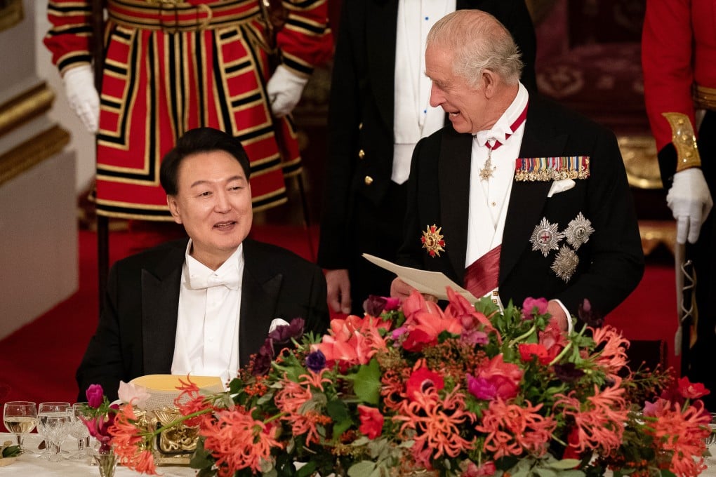 South Korean President Yoon Suk-yeol listens as Britain’s King Charles speaks at a state banquet on Tuesday. Photo: PA Wire via dpa