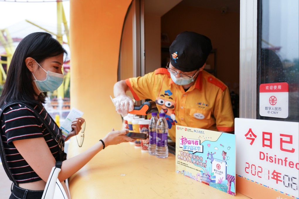 A tourist pays with digital renminbi at a theme park in Beijing in 2021. While the US drags its feet on developing a digital dollar, China and the European Union are among the major powers actively embracing central bank digital currencies. Photo: Xinhua