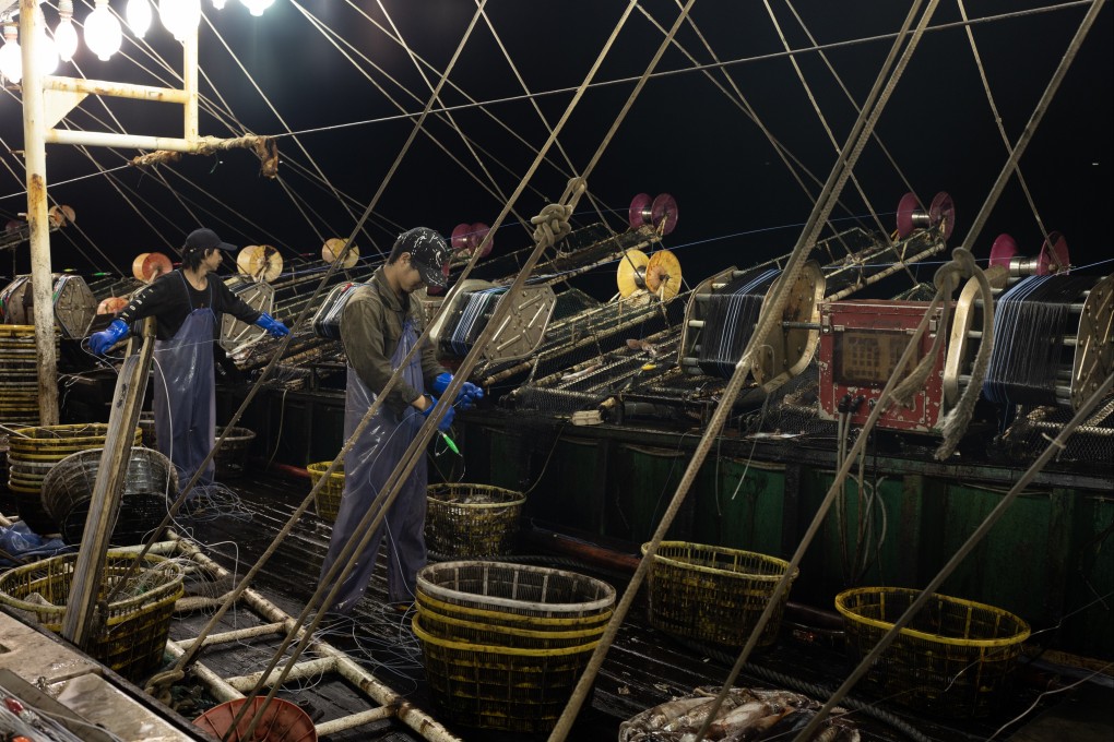 Crew work at night on board a Chinese squid-fishing vessel. China has become the undisputed global seafood superpower, but physical abuse and neglect of deckhands, sometimes leading to death, is common. Photo: The Outlaw Ocean Project/Ed Ou