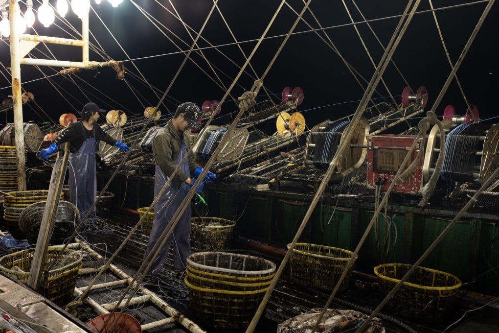 Crew work at night on board a Chinese squid-fishing vessel. China has become the undisputed global seafood superpower, but physical abuse and neglect of deckhands, sometimes leading to death, is common. Photo: The Outlaw Ocean Project/Ed Ou