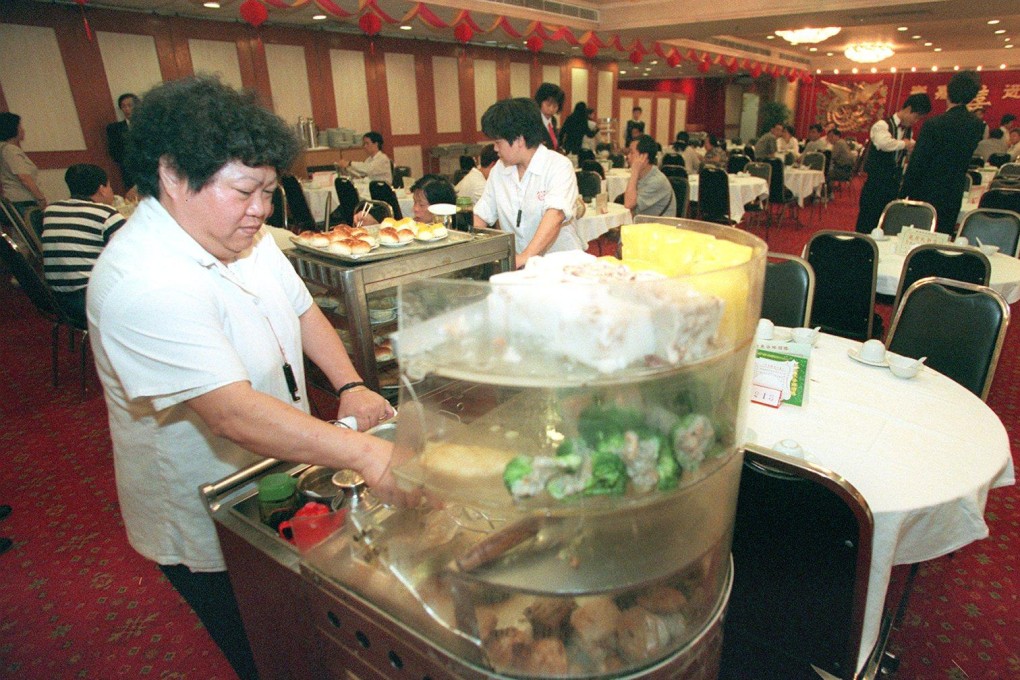 “Dim sum aunties” push trollies of food at the New Kwong Tung Seafood Restaurant in Tuen Mun, Hong Kong, in May 1997. Offering retro-themed dining events incorporating traditional dishes could form part of a “time travel” tourism concept that could boost visitors to the city. Photo: SCMP