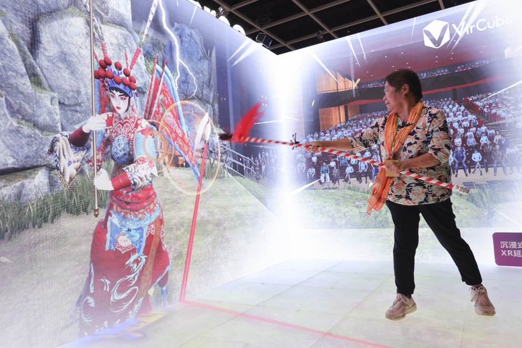 Sherra Ho “fights” a character from Cantonese opera in an extended reality space at the expo on Thursday. Photo: May Tse