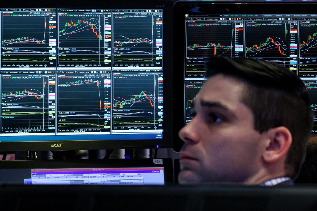 A trader works on the floor of the New York Stock Exchange on October 27. Predictions of looser policy earlier this year  quickly gave way to a dramatic repricing when it became clear to investors the Federal Reserve was not yet done tightening policy. Photo: Reuters