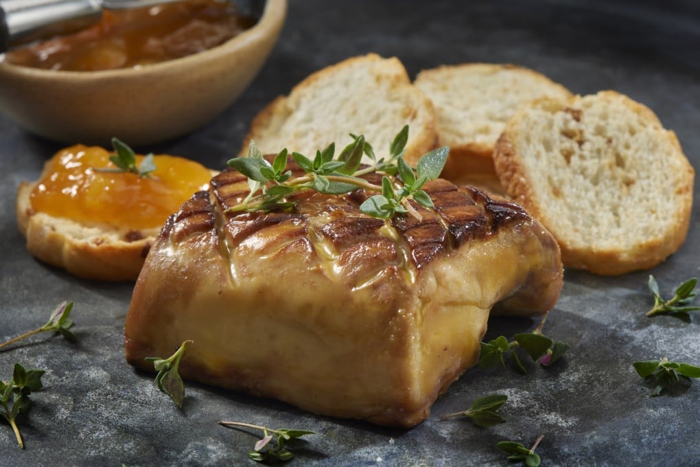Seared foie gras with apricot preserve and toasted crostini. The food, considered a delicacy in some places and banned in others on cruelty grounds, is produced by force-feeding geese. Its history began in ancient Egypt before spreading to the Mediterranean. Photo: Getty Images