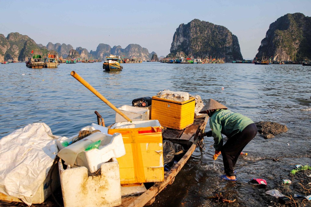 A worker picks up trash, including plastic, from Ha Long Bay in northeast Vietnam. The country is the world’s fourth largest emitter of marine plastic pollution. Photo: AFP