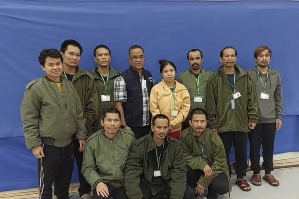 Thai workers freed by Hamas pose with a Thai official (centre) in Israel on Friday. Photo: Thailand’s Foreign Ministry via AP
