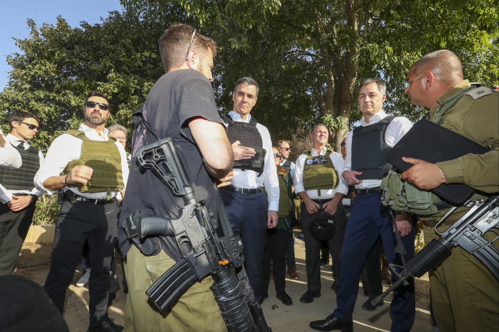 Belgian Prime Minister Alexander de Croo (second right) and Spain’s Pedro Sanchez (fourth left) visit the attacked kibbutz of Beeri a J’lem in Israel on November 23. Photo: Belga/Europa Press/dpa