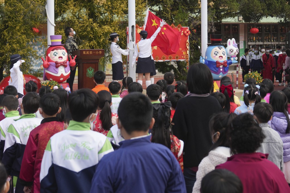 Hong Kong pupils attend a flag-raising ceremony at a primary school. The new humanities course will replace general studies, which was launched in 1996. Photo: Sam Tsang