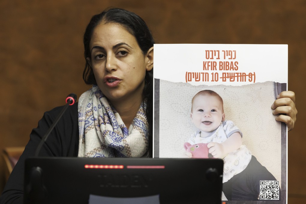 Ofri Bibas Levy, sister of Yarden Bibas, held hostage in Gaza with his wife, Shiri and two kids, Kfir and Ariel, talks to the media in Geneva, Switzerland on November 14. Photo: Keystone via AP