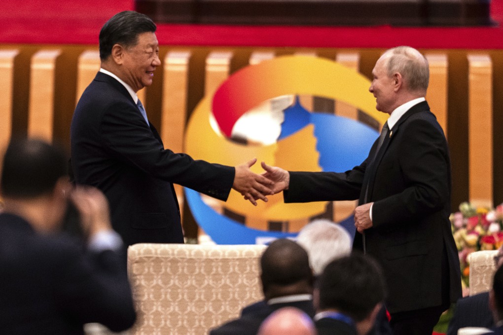 Chinese President Xi Jinping (left) and Russian President Vladimir Putin shake hands during the Belt and Road Forum at the Great Hall of the People in Beijing on October 18. Photo: AP