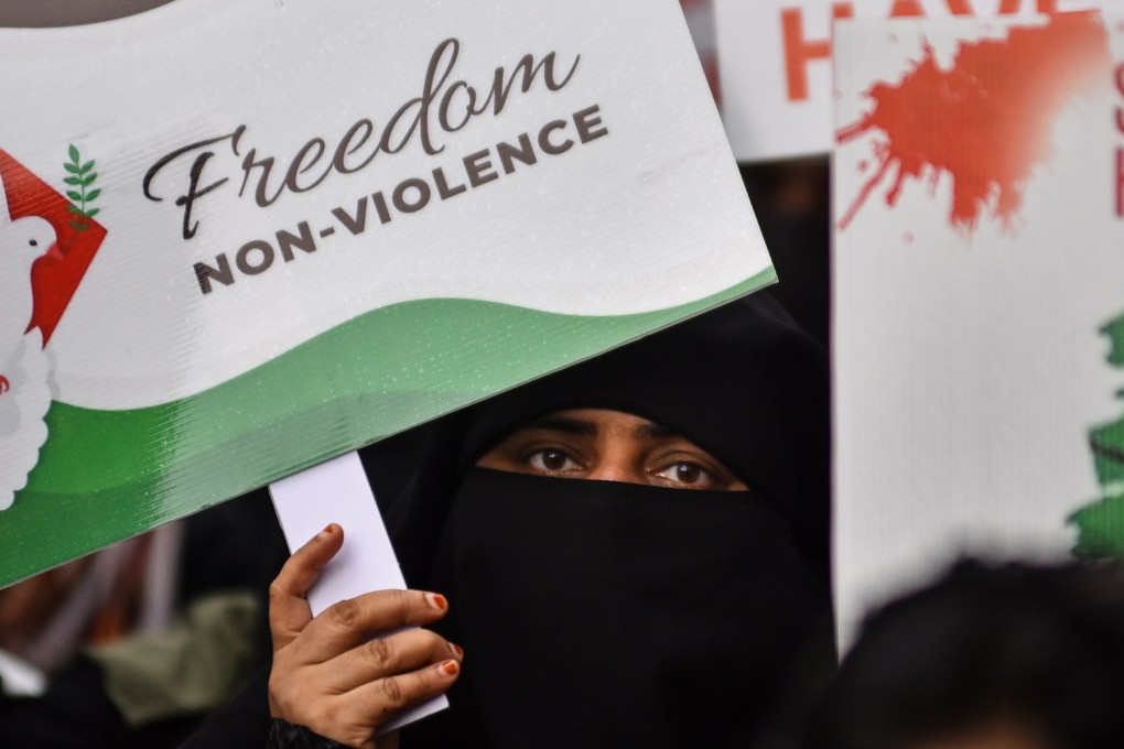 An Indian Muslim woman holds a placard as she takes part in a pro-Palestinian demonstration in Chennai last month amid the ongoing Israel-Gaza conflict. Photo: EPA-EFE