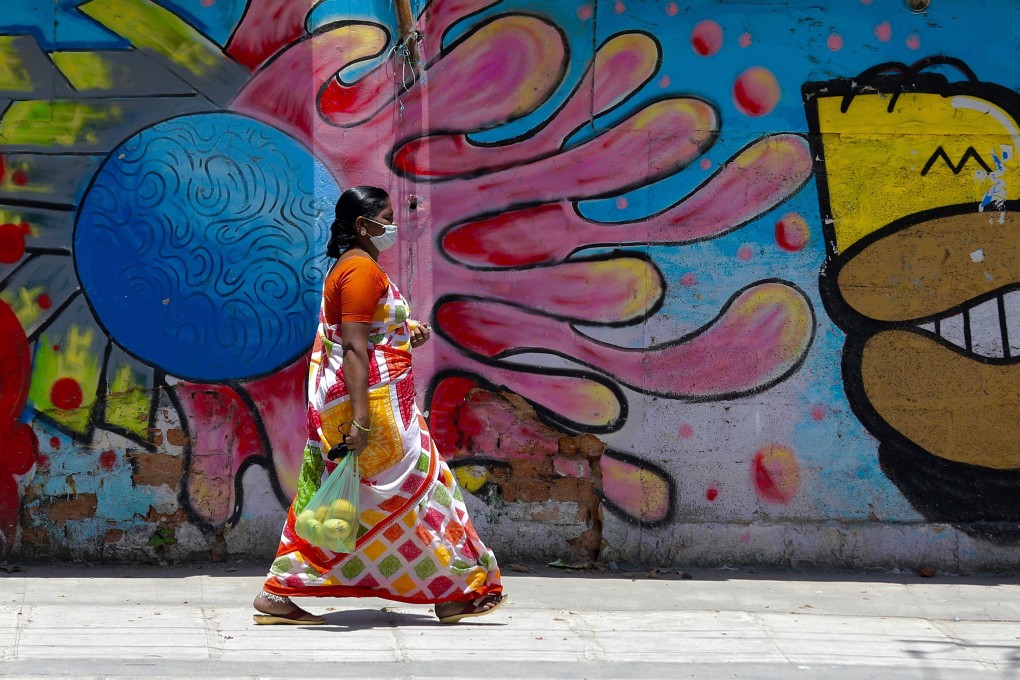 An Indian woman walks outdoors after the end of Bangalore’s lockdown, on May 15, 2020. Photo: EPA-EFE
