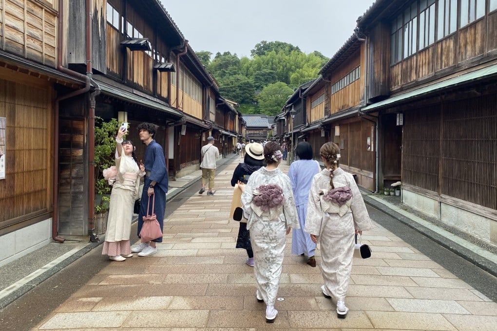 People dressed in traditional Japanese clothing in Higashi Chaya, one of Kanazawa’s three geisha districts. Old arts and crafts are alive in the Japanese city filled with Edo-era homes, museums, workshops. Photo: Tamara Hinson