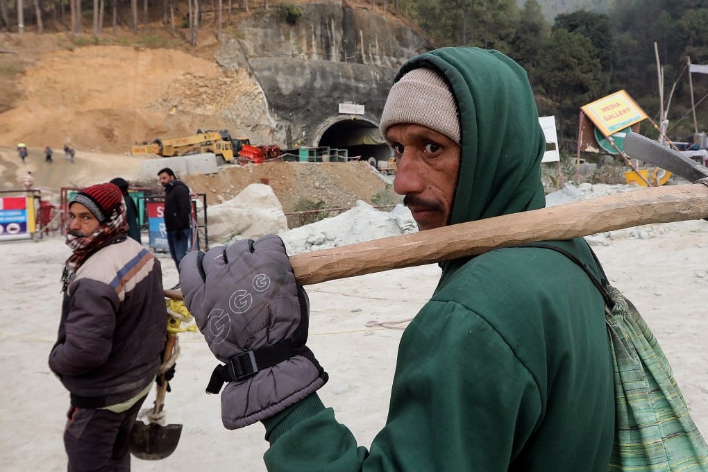 A worker arrives at the site of the Silkyara tunnel that collapsed while being under construction, to join in rescue operations, in Uttarkashi, India. Photo: EPA-EFE