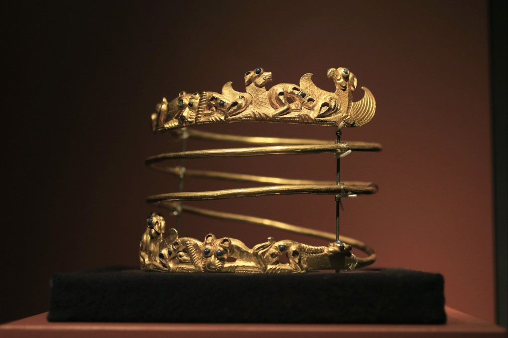 A spiralling torque from the second century AD on display as part of The Crimea - Gold and Secrets of the Black Sea exhibition, at Allard Pierson museum in Amsterdam in 2014. A collection of Crimean treasures was returned to Ukraine on Monday. Photo: AP