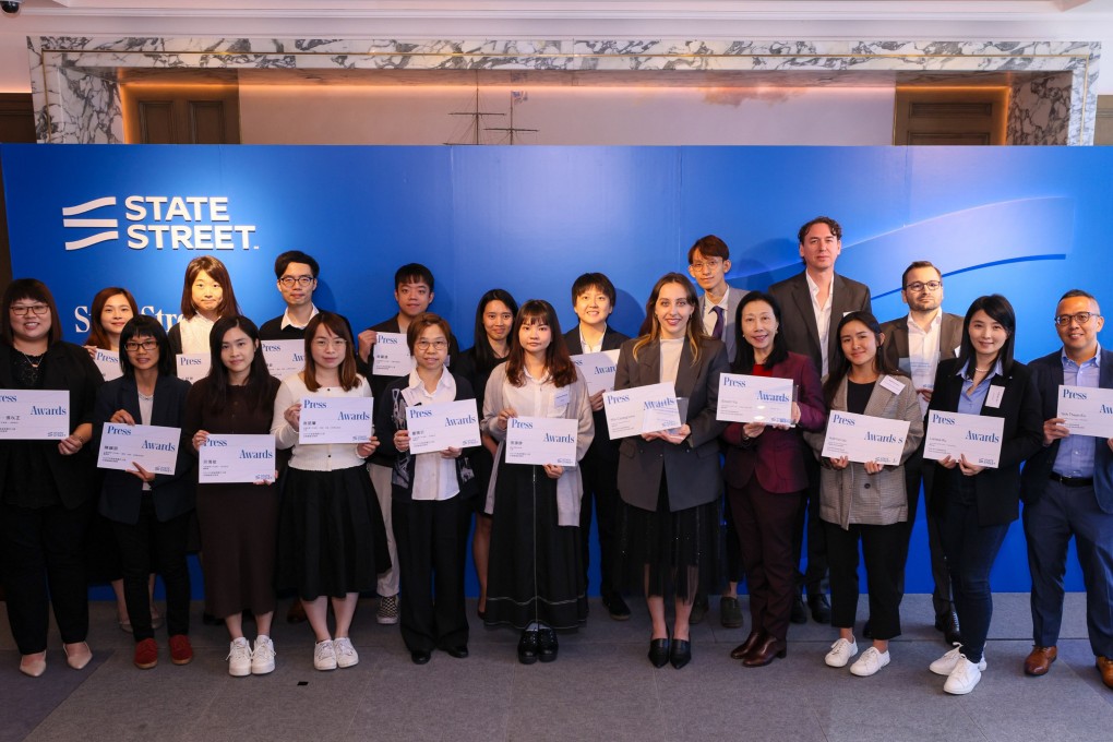 SCMP’s journalists Enoch Yiu (fourth right, front) and Mia Castagnone (fifth right, front) with their winners’ certificates at State Street Corporation’s 2023 Asia-Pacific Institutional Press Awards at the American Club on November 28, 2023. Photo: State Street