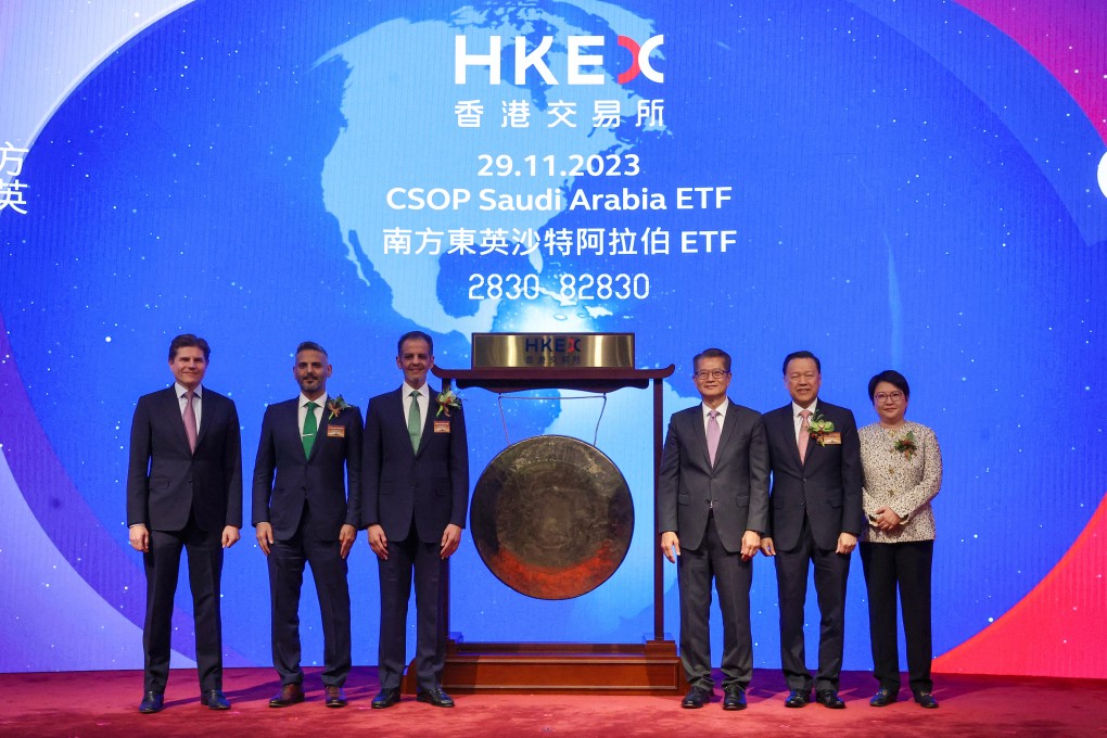 (From left) Nicolas Aguzin, CEO of HKEX; Abdulmajeed Alhagbani, head of securities investments at PIF; Yazeed Al-Humied, the deputy governor of PIF; Financial Secretary  Paul Chan; SFC chairman Lui Tim Leung and CSOP CEO Ding Chen attend the listing ceremony of the CSOP Saudi Arabia ETF on Wednesday. Photo: Edmond So