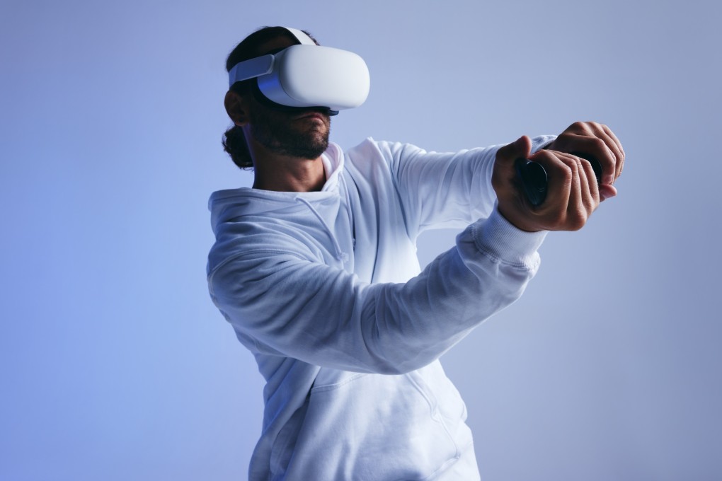 A gamer plays a video game using a virtual reality headset. From PlayStation 5, Xbox and Nintendo Switch controllers to the Meta Quest 3, we look at six of the best gift options in 2023 for the video game lover in your life. Photo Shutterstock