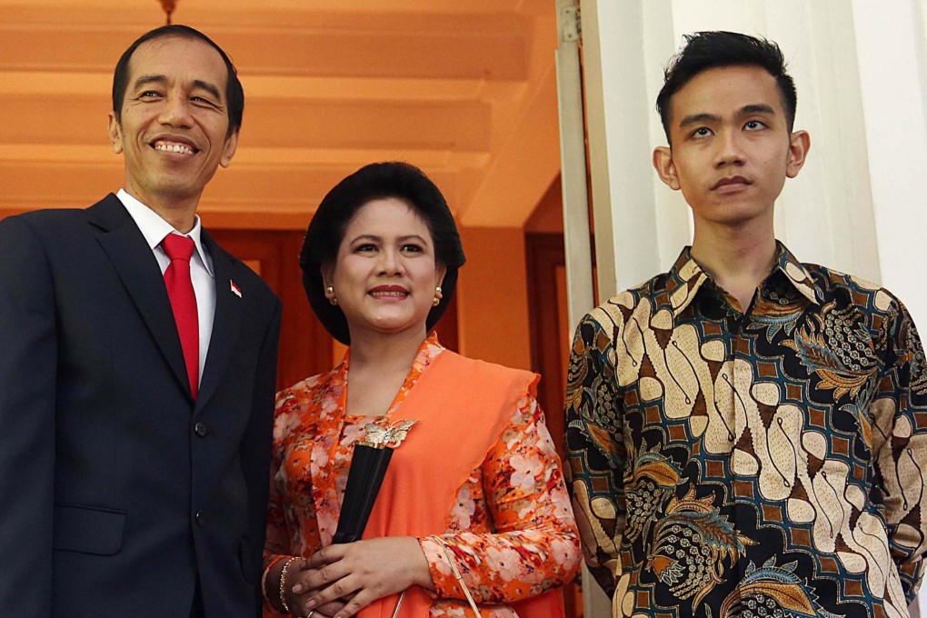 Indonesia’s President Joko Widodo with his wife Iriana and son Gibran Rakabuming at the Jakarta governor’s residence on October 20, 2014. Photo: AFP