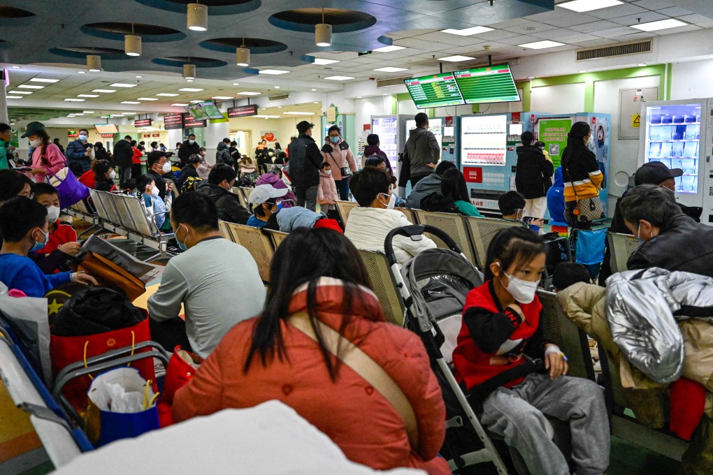 Parents and youngsters wait to be helped in the outpatient area of a Beijing children’s hospital. A spike in respiratory ailments among children in China’s capital city and the northeastern province of Liaoning has raised worries of a wider outbreak involving a new virus. Photo: AFP