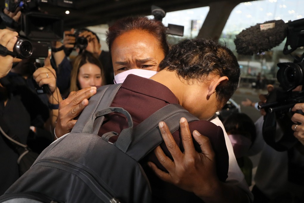 Thai migrant worker Phonsawan Pinakalo (L), who was taken hostage by the Palestinian militan group Hamas,, hugs his mother as a group of released Thai hostages arrives from Israel at Bangkok’s Suvarnabhumi Airport on Thursday. Photo: EPA-EFE