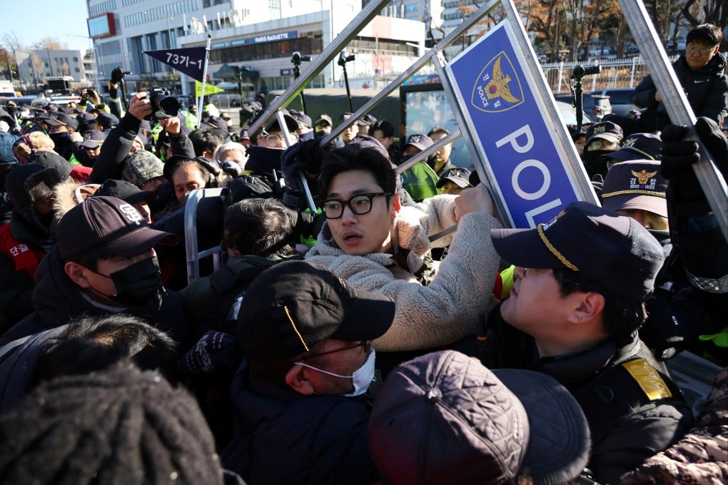 Dog farmers scuffle with South Korean police during a protest in Seoul on Thursday. Photo: Reuters