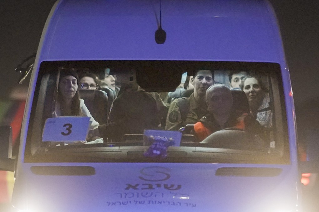 A mini-bus carrying Israeli hostages arrives at the Sheba Medical Center in Ramat Gan, Israel, early Thursday. Photo: AP