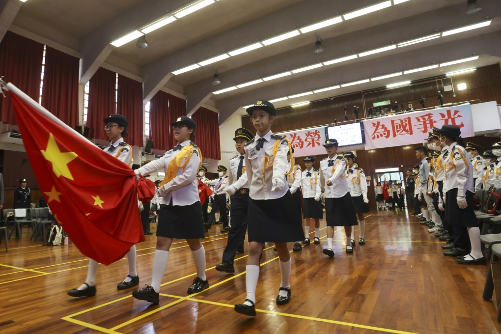 Hong Kong students take part in a flag-bearing competition in May. Patriotic values aside, Hong Kong should not overlook the importance of whole-person education. Photo: Jonathan Wong